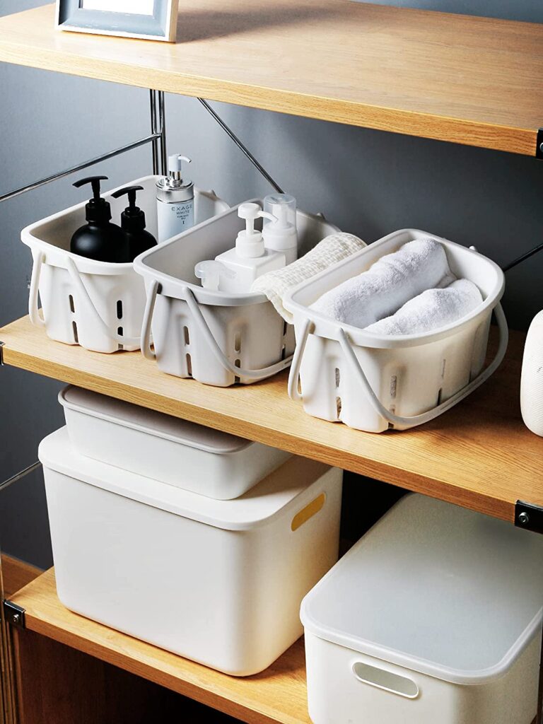 under the bathroom sink storage idea using portable shower caddy totes from Amazon